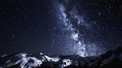 Milky Way over snowy mountains