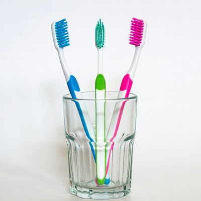 Colorful Toothbrushes in Glass