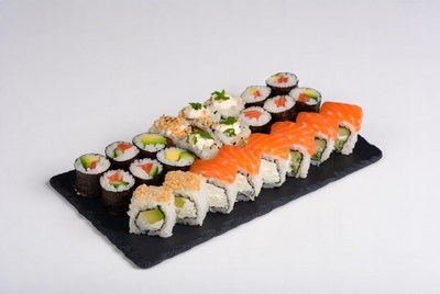 Assorted Sushi Rolls on Slate Board