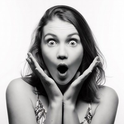 Surprised woman with wide eyes and open mouth
