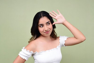 Latina woman waving hand smiling