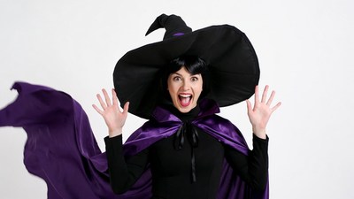 Excited woman in witch costume