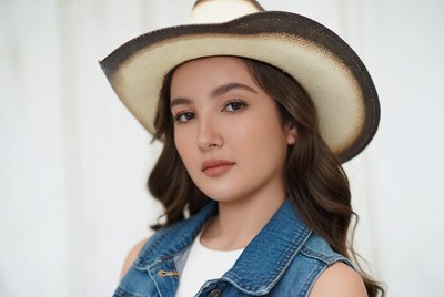 Asian woman wearing cowboy hat