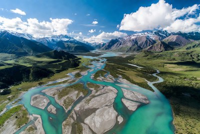 Turquoise River Winding Through Mountains