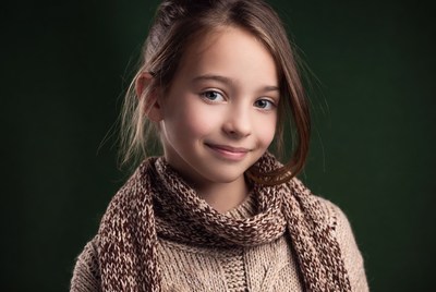 Smiling girl in brown scarf