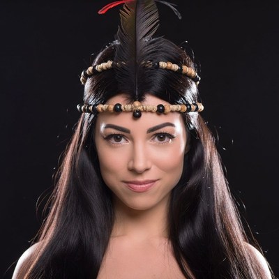 Woman wearing Native American feather headdress