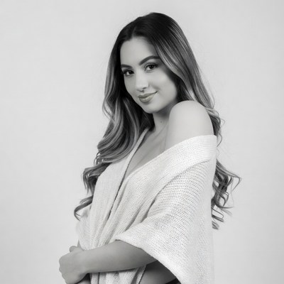 Smiling woman in off-shoulder sweater