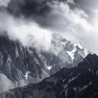 Stormy Clouds Over Snowy Mountains