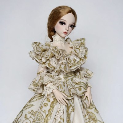 BJD doll in gold lace gown