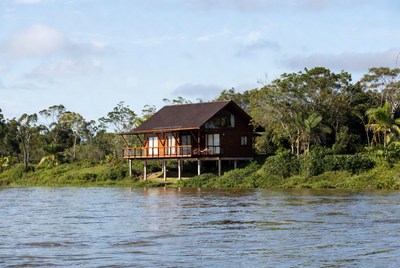 Wooden Cabin on Riverbank
