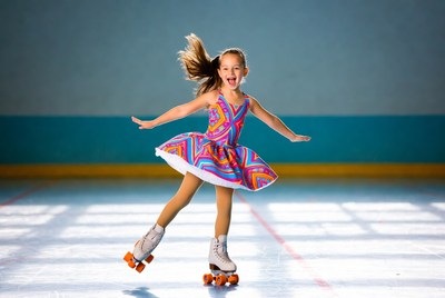 Girl roller skating in colorful dress