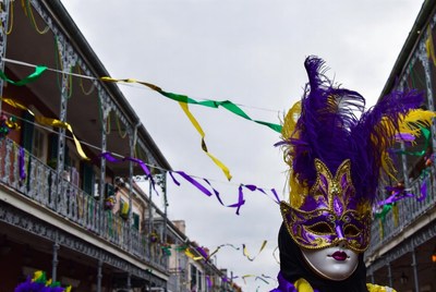 Woman in Purple Feather Mardi Gras Mask