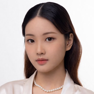 Asian woman in white blouse