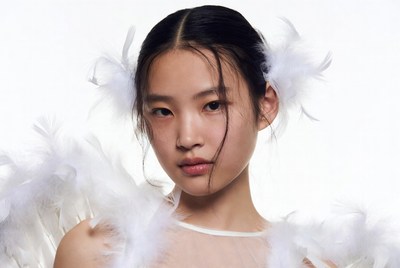 Asian woman with white feathers