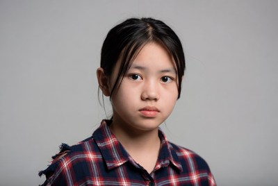 Asian girl in plaid shirt