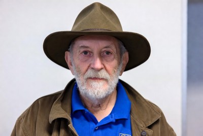 Elderly man wearing brown hat