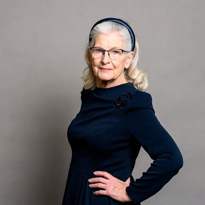 Elderly woman in navy dress with headband
