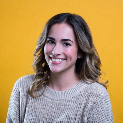 Smiling woman with wavy brown hair