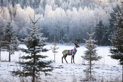 Colorful Painted Reindeer in Snowy Forest