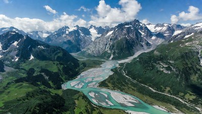Aerial View of Turquoise River in Alps