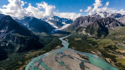 Aerial View of Turquoise River in Alps