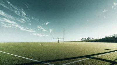Rugby goalposts on green field
