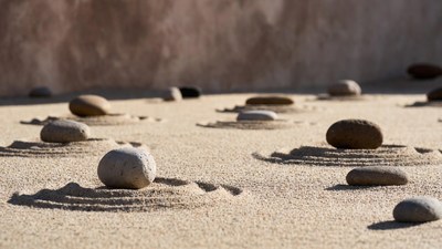 Rocks arranged in sand garden