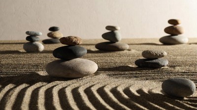 Stacked stones on zen sand garden
