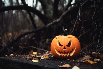 Jack-o'-lantern in spooky forest