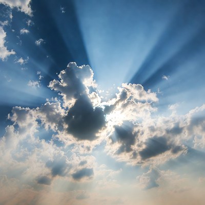 Sun rays beaming through clouds
