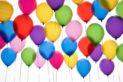 Colorful Balloons Floating on White Background