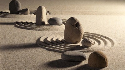 Rocks Balanced in Sand Ripples