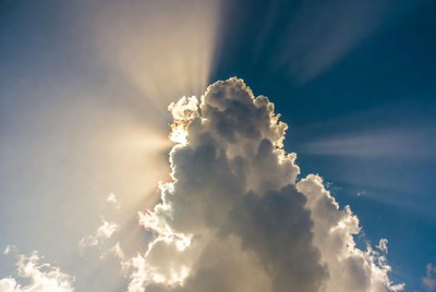 Sun rays beaming through clouds