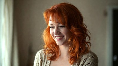Smiling woman with red hair