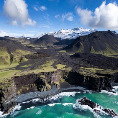 Aerial View of Volcanic Mountains and Beach