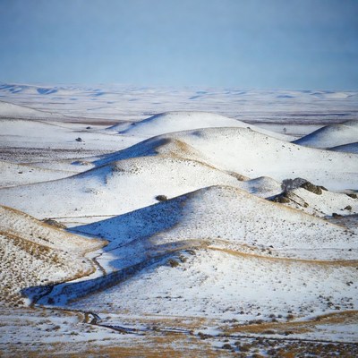 Snowy Hills in Vast Winter Landscape