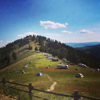 Camping tents and RVs on mountain hillside