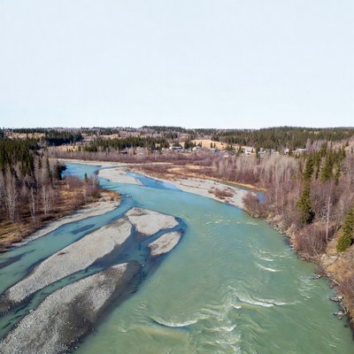 Aerial view of winding turquoise river
