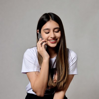 Young woman smiling on phone call