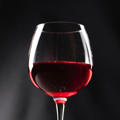 Red Wine Glass on Black Background