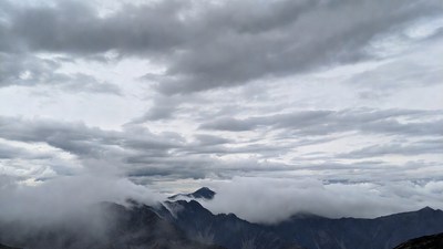 Cloudy Mountains with Foggy Peaks