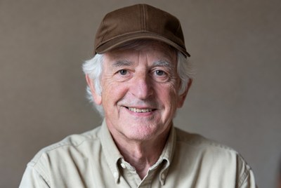 Elderly man wearing brown cap