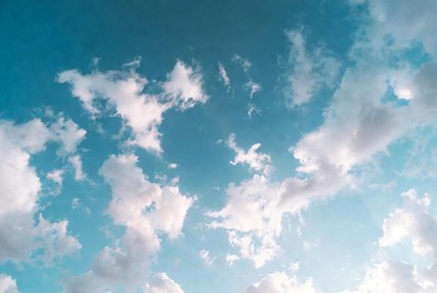 Fluffy Clouds in Blue Sky