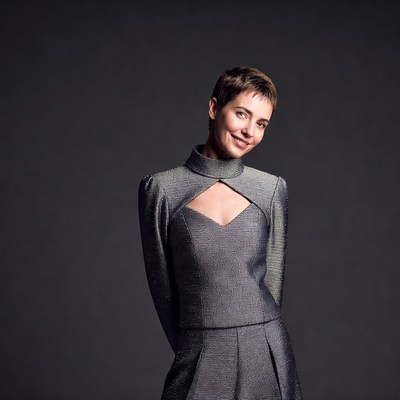 Smiling woman in metallic dress