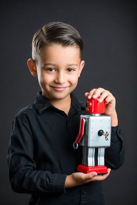 Boy holding red robot toy