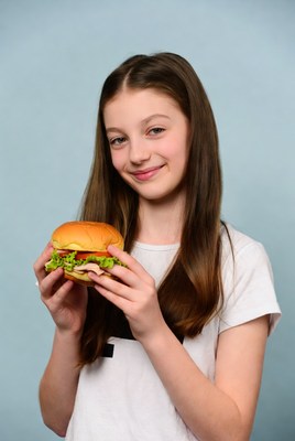 Girl holding burger