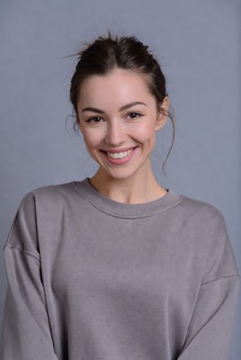 Smiling woman in gray sweatshirt
