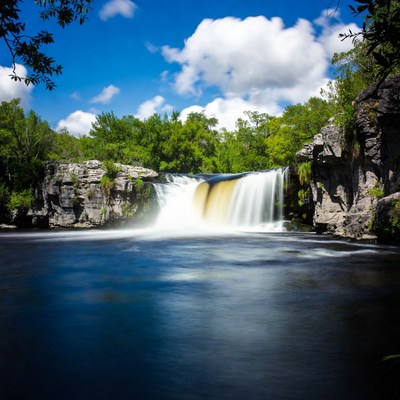 Waterfall cascading over rocky cliffs