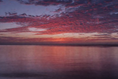 Vibrant Sunset Over Calm Water