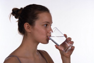 Woman drinking water from glass
